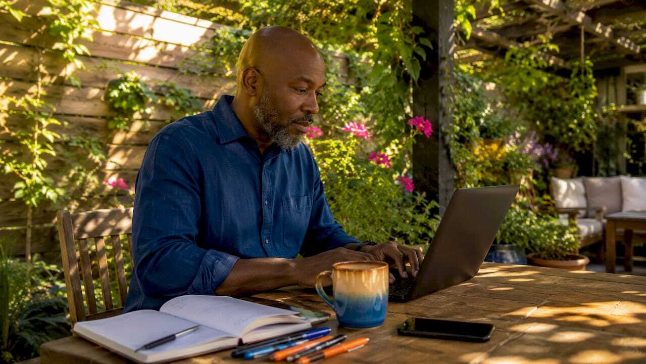 Content creator typing in urban home office